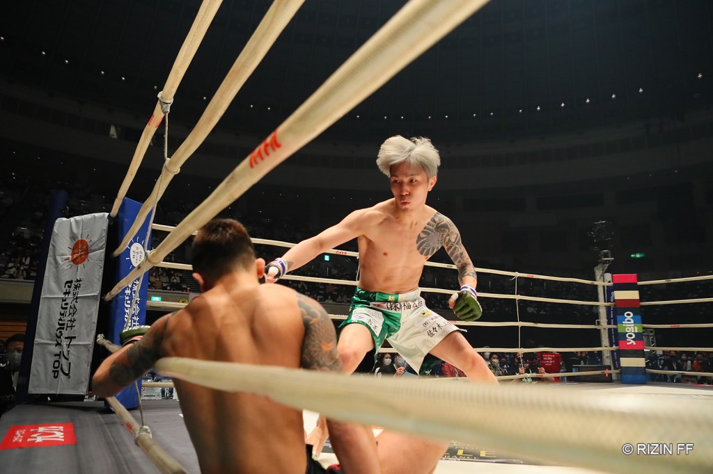 Yuki Ito charges at Kohei Sugiyama after scoring a knockdown.