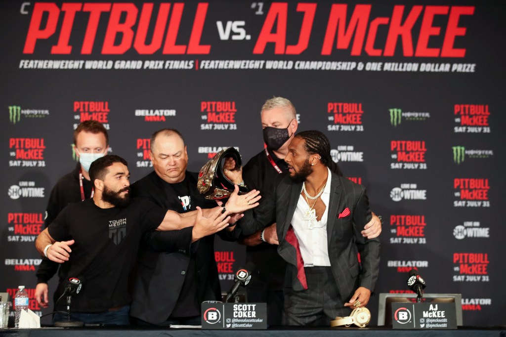 Patricio Pitbull and AJ McKee get in each other's faces at a press conference.