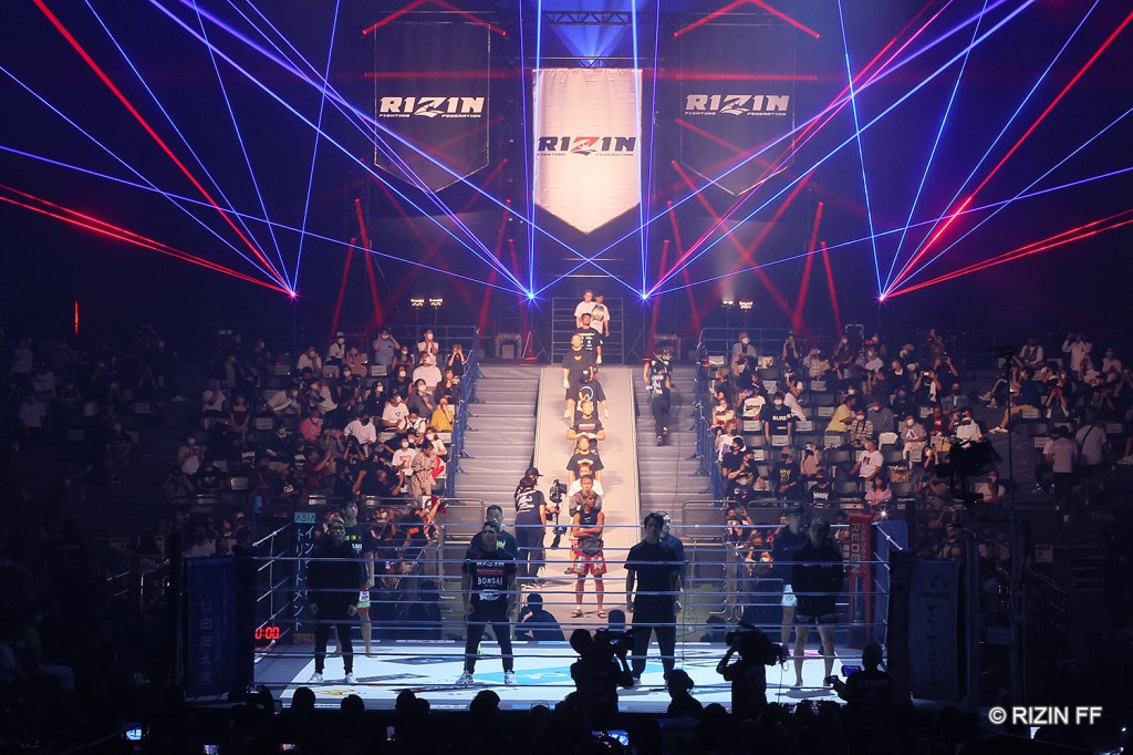RIZIN fighters stand on a stage during their opening ceremony.