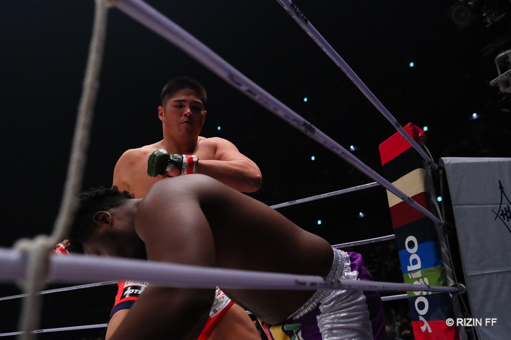 Tsuyoshi Sudario looks as SAINT falls to the canvas.