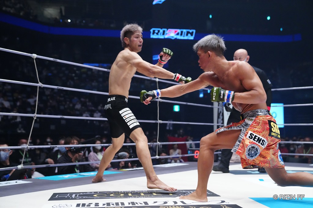 Sho Sekihara throws a right hand at TARKER.