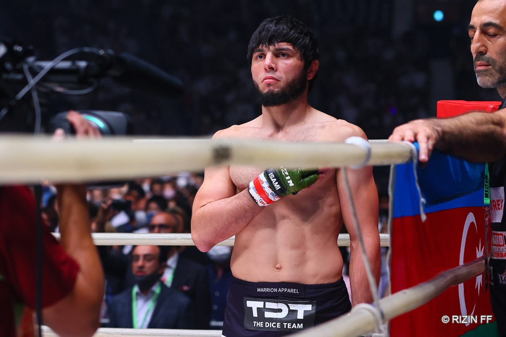 Tofiq Musayev stands in the corner of a RIZIN ring.