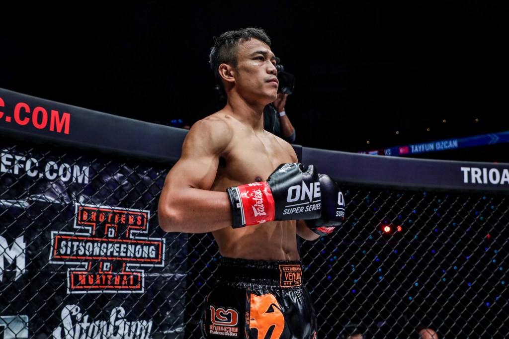 Sitthichai Sitsongpeenong stands inside the ONE Championship cage.
