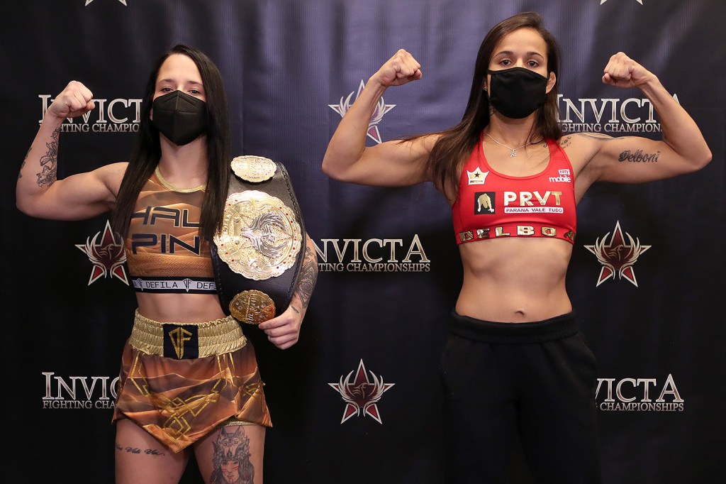 Alesha Zappitella and Jessica Delboni pose at an Invicta FC weigh-in.