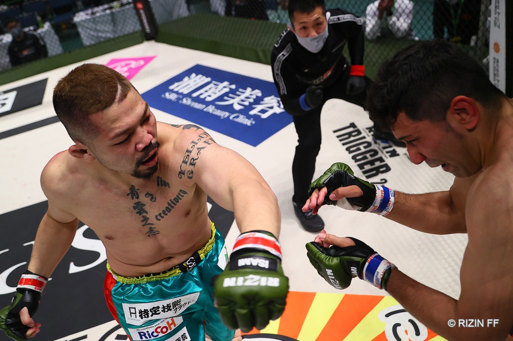 Kohei Tokeshi throws a left hook at Harry Stallone.