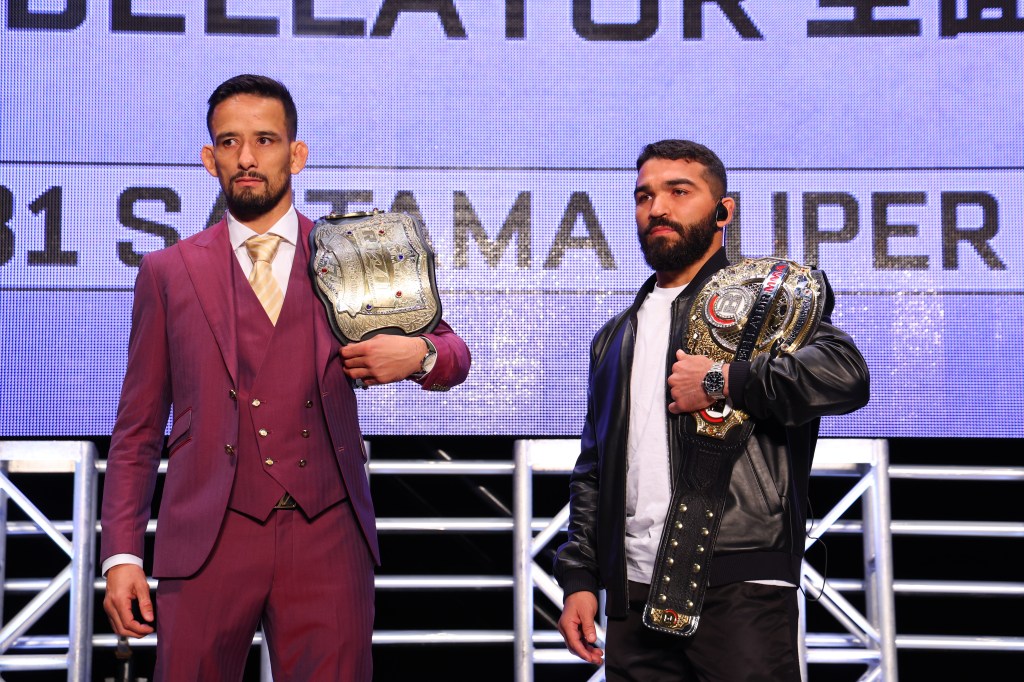 Kleber Koike holds the RIZIN Featherweight Championship beside Patricio Pitbull, who holds the Bellator Featherweight Championship.